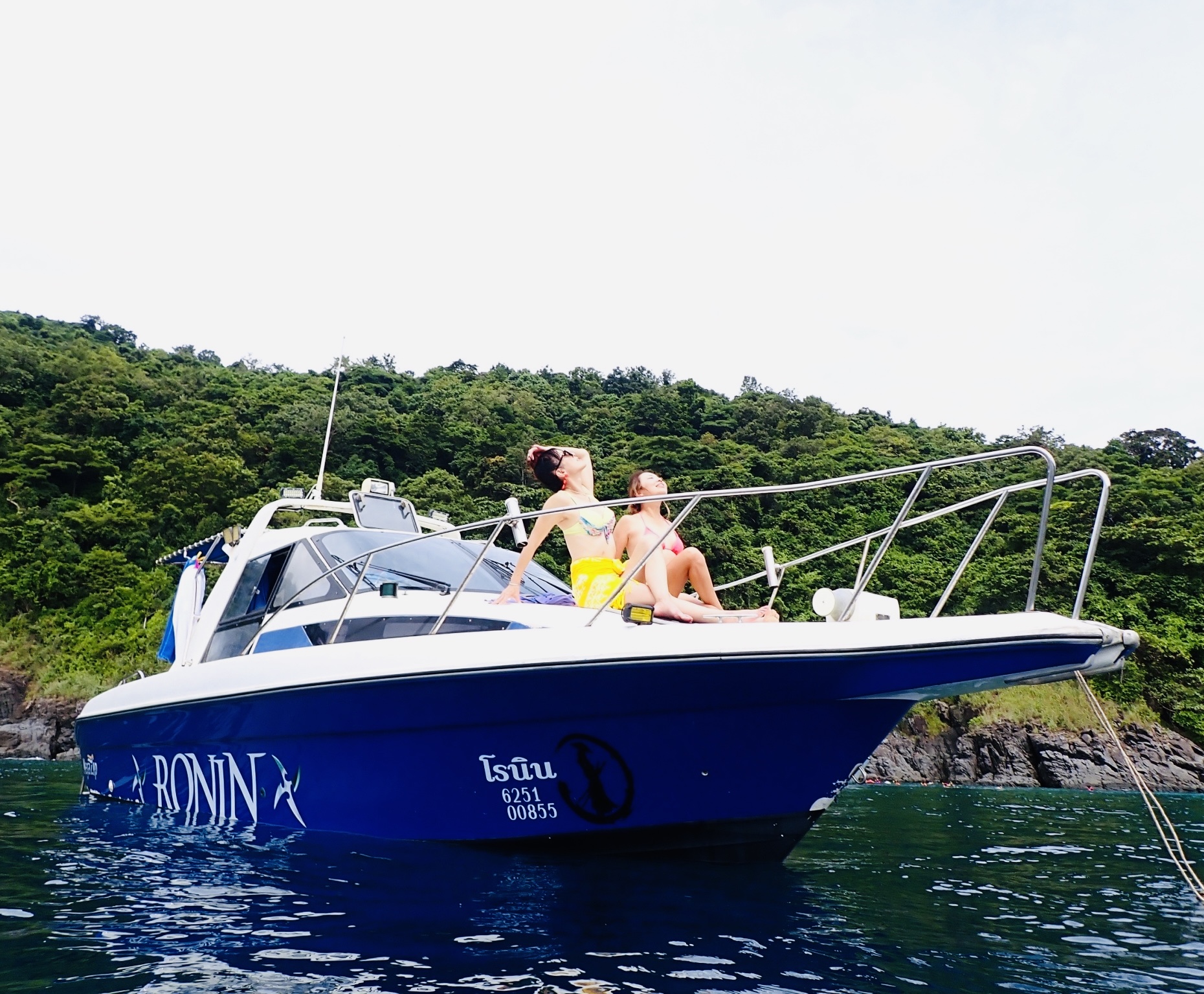 Guests enjoying snorkeling with colorful tropical fish in Phuket.