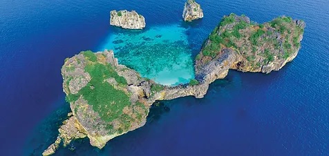 Aerial view of Koh Haa's crystal-clear lagoon and limestone islands in southern Thailand