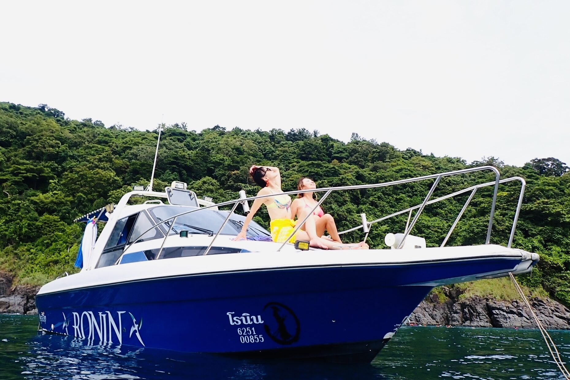 Guests enjoying snorkeling with colorful tropical fish in Phuket.